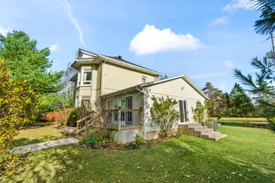 an image of a house with a yard at Spacious Beach Town Retreat - Sleeps 8 in Port Elgin