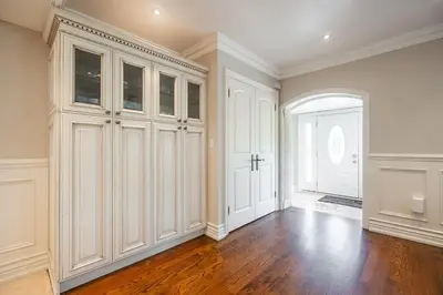 a large room with white cabinets and a door at 3 Bedroom Luxury House in Toronto in Toronto