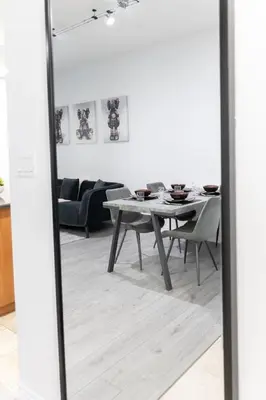 a dining room with a table and a dining roomiasm at Modern 1BR and 1BA condo near Downtown with City Views in Toronto