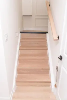 a staircase in a house with wooden floors at Luxurious Home Away From Home in Pickering