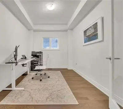 an office with a desk and a computer in a room at Cambridge Luxury by Ravine in Cambridge