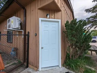 a door on a building with aperature at Modern Tiny Wood Cottage #2 in Wasaga Beach