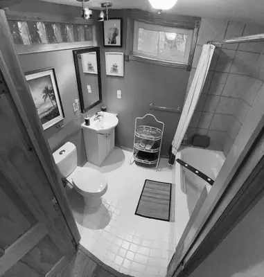 a bathroom with a toilet and a sink and a shower at Country Roads Dwelling in Hamilton