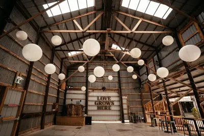 a large barn with white lights hanging from the ceiling at Country Roads Dwelling in Hamilton