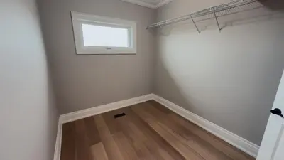 a room with a window and a wooden floor at Upscale Pickering Escape Near Lake & Dining in Pickering