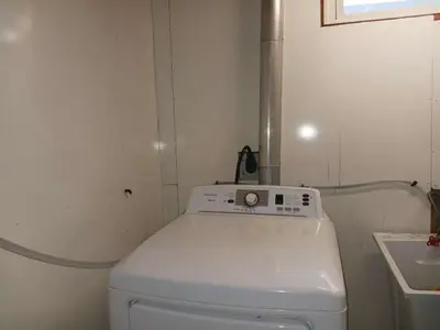 a small bathroom with a toilet and a sink at Budget Stay In Heart of Waterloo-Free Wifi-Parking in Waterloo