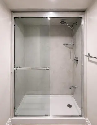 a shower with a glass door in a bathroom at Newly Renovated 3BR Orangeville Basement Suite with Private Access, 10 Min Walk to Headwaters Hospital, 5 Min Drive to Mount Alverno! Ideal for Medical Stay, Family Travel & Work Trips! in Orangeville