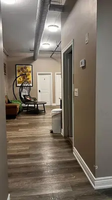 an empty room with a hallway with wood floors at Downtown Private Room Central Location in Toronto