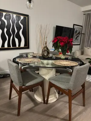 a dining room with a glass table and chairs at Beautiful Quaint Home in Port Credit, Mississauga in Mississauga