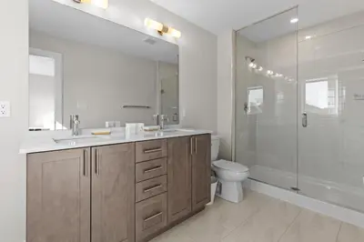 a bathroom with a sink and a shower and a toilet at Luxury Townhome in Oakville