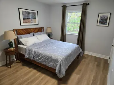 a bedroom with a bed and a window at Streetsville Retreat - Prime Location in Mississauga