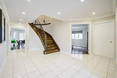 a hallway with a staircase in a house at Upper-Level Classic House in Richmond Hill in Richmond Hill