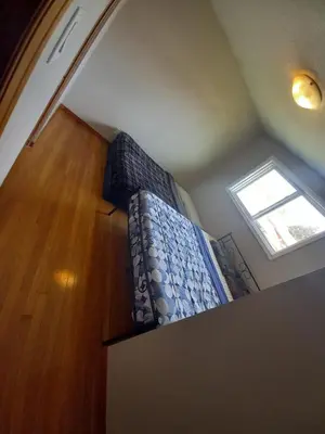 a bedroom with a bed and a window on the floor at Stay in Waterloo-Kitchener-Downtown-FREE WIFI & PARKING in Waterloo