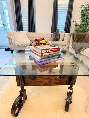 a stack of books sitting on top of a glass table at Welcome to Your Home Away From Home! in Mississauga