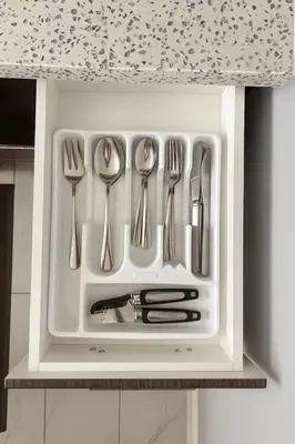 a drawer filled with silver utensils in a kitchen at Cozy 3BR Caledon Basement Suite with Private Access, Full Kitchen, WiFi, Laundry, Backyard Basketball Court & Creek Trail, 5 Mins to Brampton! Great for Families & Long Stays! in Caledon