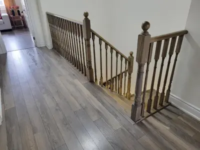 a hallway with a wooden staircase with wooden floors at Luxury Suite - Master Bedroom in Niagara Falls