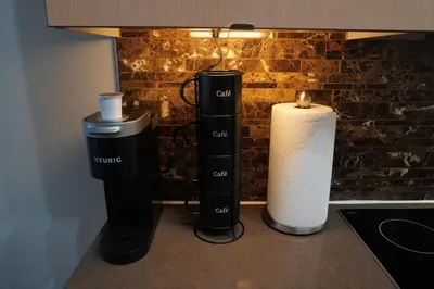 a counter top with three differentiatesiatesiatesiatesiatesiatesiatesiatesiatesiates at Downtown Toronto Condo with CN Tower View in Toronto