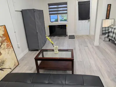 a living room with a coffee table and a couch at Cozy Bachelor Unit in Guelph