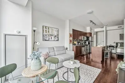 a living room with a couch and a table at Spacious 2BR Condo Downtown, Lakeshore, Parking in Toronto