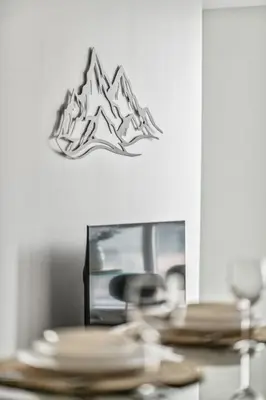 a table with plates and a sign on the wall at Spacious 2BR Condo Downtown, Lakeshore, Parking in Toronto