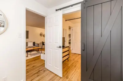 a door leading into a room with a kitchen at The Landing Pad - Condo in Collingwood in Collingwood