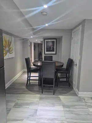 a dining room with a table and chairs at Whitby one bedroom apartment in Whitby