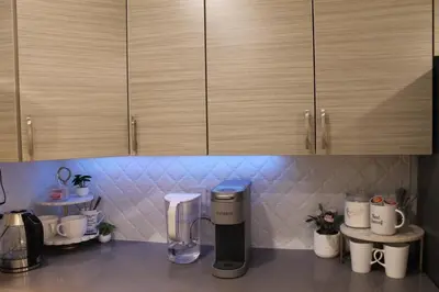 a kitchen counter with a blender and cabinets at Queen Bed Suite-Private Entrance in Barrie