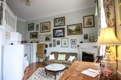 a living room with a couch and a table at The Jypsy Inn - The Royal Suite Bracebridge in Bracebridge