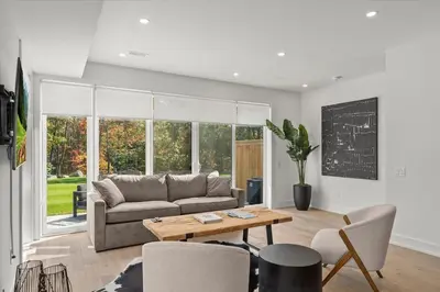a living room with a couch and a table at Luxury Muskoka Retreat in Gravenhurst