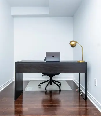 a desk with a laptop computer on top of it at Vacation Home in Vaughan in Vaughan