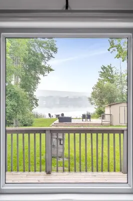 a window of a porch with a view of a field at Lake lodge 6 in Frankford