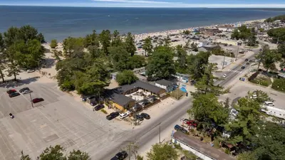 an overhead view of a parking lot next to the ocean at Adrian's Suites 2 Bedroom Family Suite in Wasaga Beach