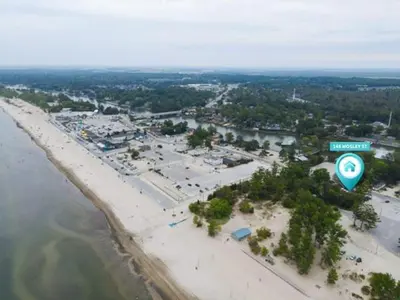 an aerial view of a beach with a street sign at Adrian's Suites 1 Bedroom Junior Suite in Wasaga Beach