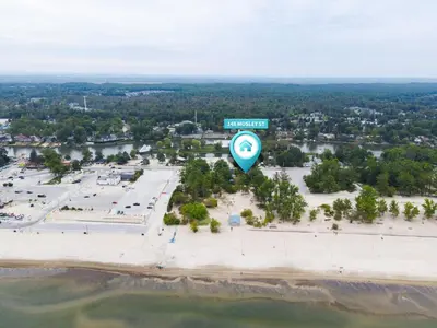 an aerial view of a parking lot with a street sign at Adrian's Suites 2Bedroom Family Suite in Wasaga Beach