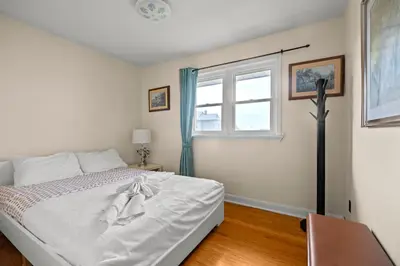 a bedroom with a bed and a window at Beautiful home, a few minutes to the waterfall and attractions in Niagara Falls