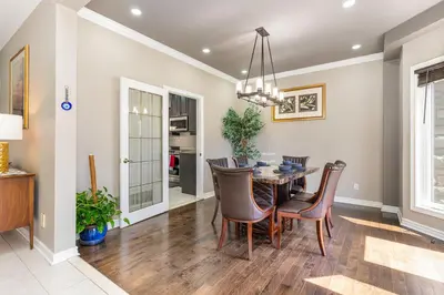 a dining room with a table and chairs at Home in Richmond Hill in Richmond Hill