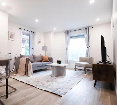 a living room with a couch and a tv at The Willow Suite Near DT & Hospital in Peterborough