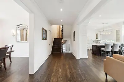 a living room with a dining room and a kitchen at Quiet Getaway Perfect for Families and Retreats in Mississauga