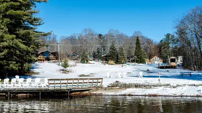 a snow covered area with a dock and a snow covered field at Lake Muskoka 3-bedroom Cottage - Pier 100 #30 in Port Carling