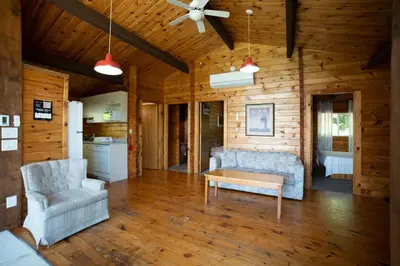 a living room with a couch and a table at Lake Muskoka 3-bedroom Cottage - Pier 100 #20 in Port Carling