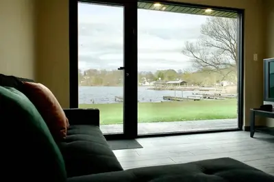 a living room with a couch and a large sliding glass door at 1-bedroom Townhouse in Harwood #3 in Harwood