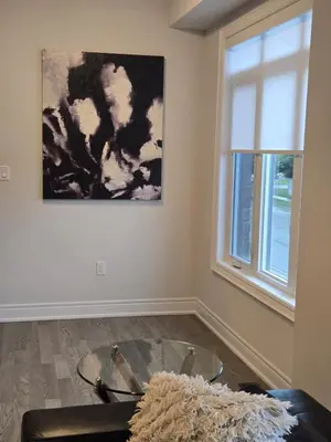a living room with a glass table and a window at Modern 4 Bedroom Home -Oakville in Oakville