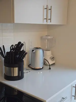a kitchen counter with a toaster and a blender on it at Modern 4 Bedroom Home -Oakville in Oakville