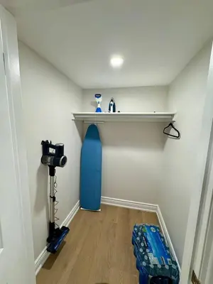 a room with a shelf and a blue object on the wall at 2 BR Private Basement Suite | Minutes from YYZ in Brampton
