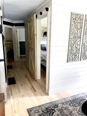 a room with a door leading to a bedroom at The Muskoka Nest in Utterson