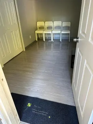a group of chairs in a room with a door at 5-bedroom Villa in East Gwillimbury in East Gwillimbury