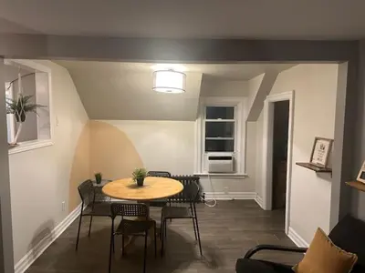 a dining room with a table and chairs at Maple Falls Oasis By Tig Management in Niagara Falls