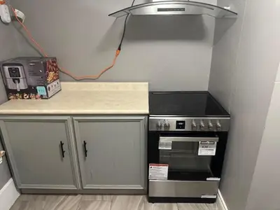 a small kitchen with a stove and a counter top at Maple Falls Oasis By Tig Management in Niagara Falls