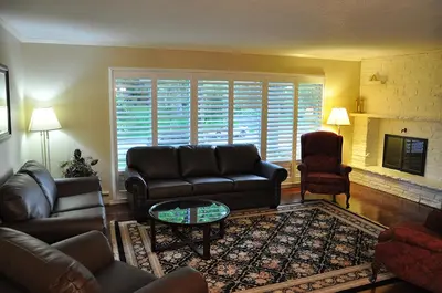 a living room with a couch and a coffee table at Forest Hill Bed and Breakfast in Kitchener