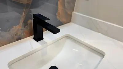a white sink with a black faucet in a bathroom at Luxury 2-Bedroom Designer Suite Richmond Hill Lake Wilcox in Richmond Hill